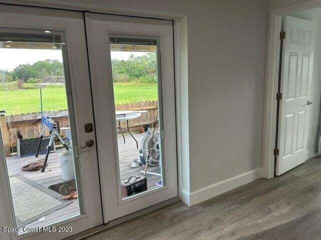 520 Atz Road, Unit COTTAGE Malabar, FL 32950 - Photo 18 of 25 a view of a living room and floor to ceiling window