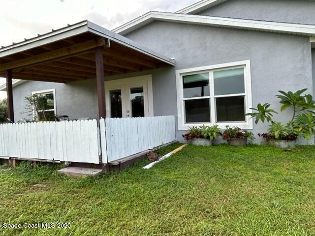 520 Atz Road, Unit COTTAGE Malabar, FL 32950 - Photo 2 of 25 a view of a house with a yard