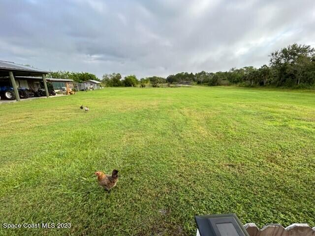 520 Atz Road, Unit COTTAGE Malabar, FL 32950 - Photo 25 of 25 a house view with swimming pool in front of it
