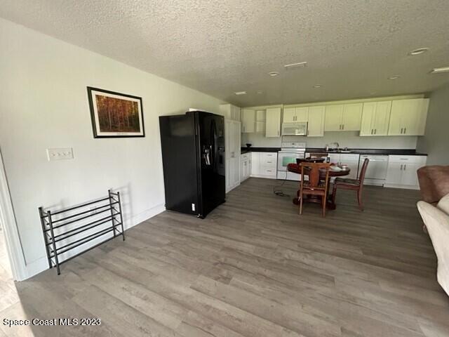 520 Atz Road, Unit COTTAGE Malabar, FL 32950 - Photo 10 of 25 a view of kitchen with furniture and refrigerator