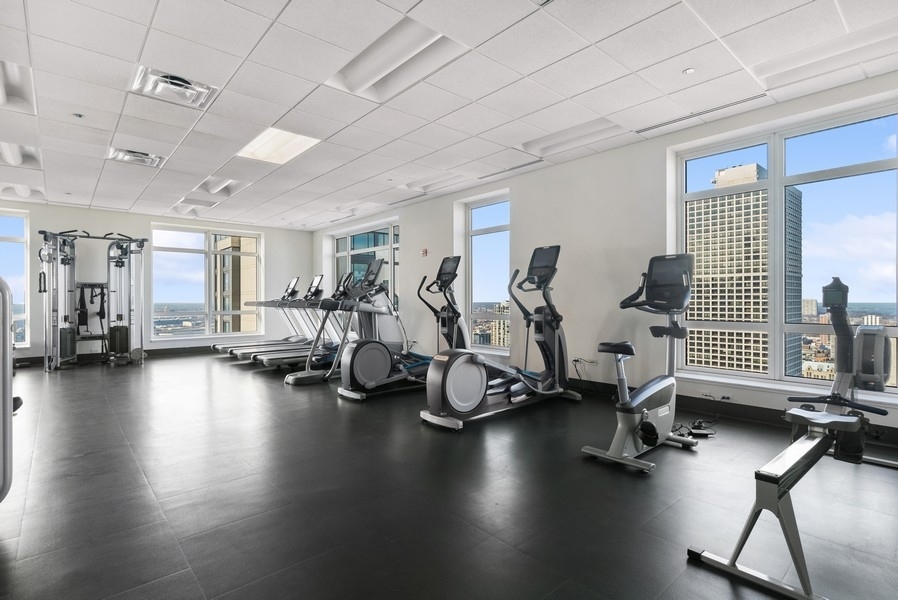 10 East Delaware Place, Unit 21D Chicago, IL 60611 - Photo 30 of 33 a view of a room with gym equipment
