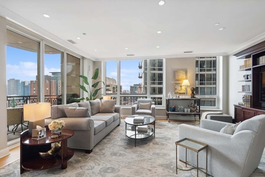 10 East Delaware Place, Unit 21D Chicago, IL 60611 - Photo 6 of 33 a living room with furniture and a large window
