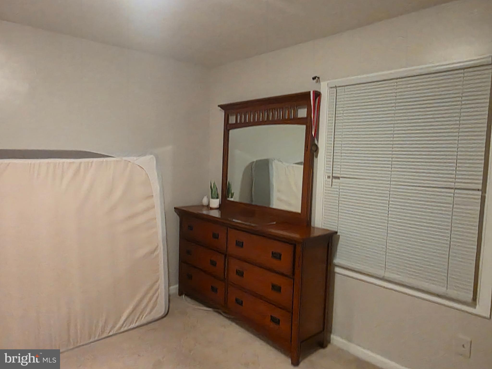44 Peacock Lane Willingboro, NJ 08046 - Photo 12 of 23 a room with a dresser and a mirror