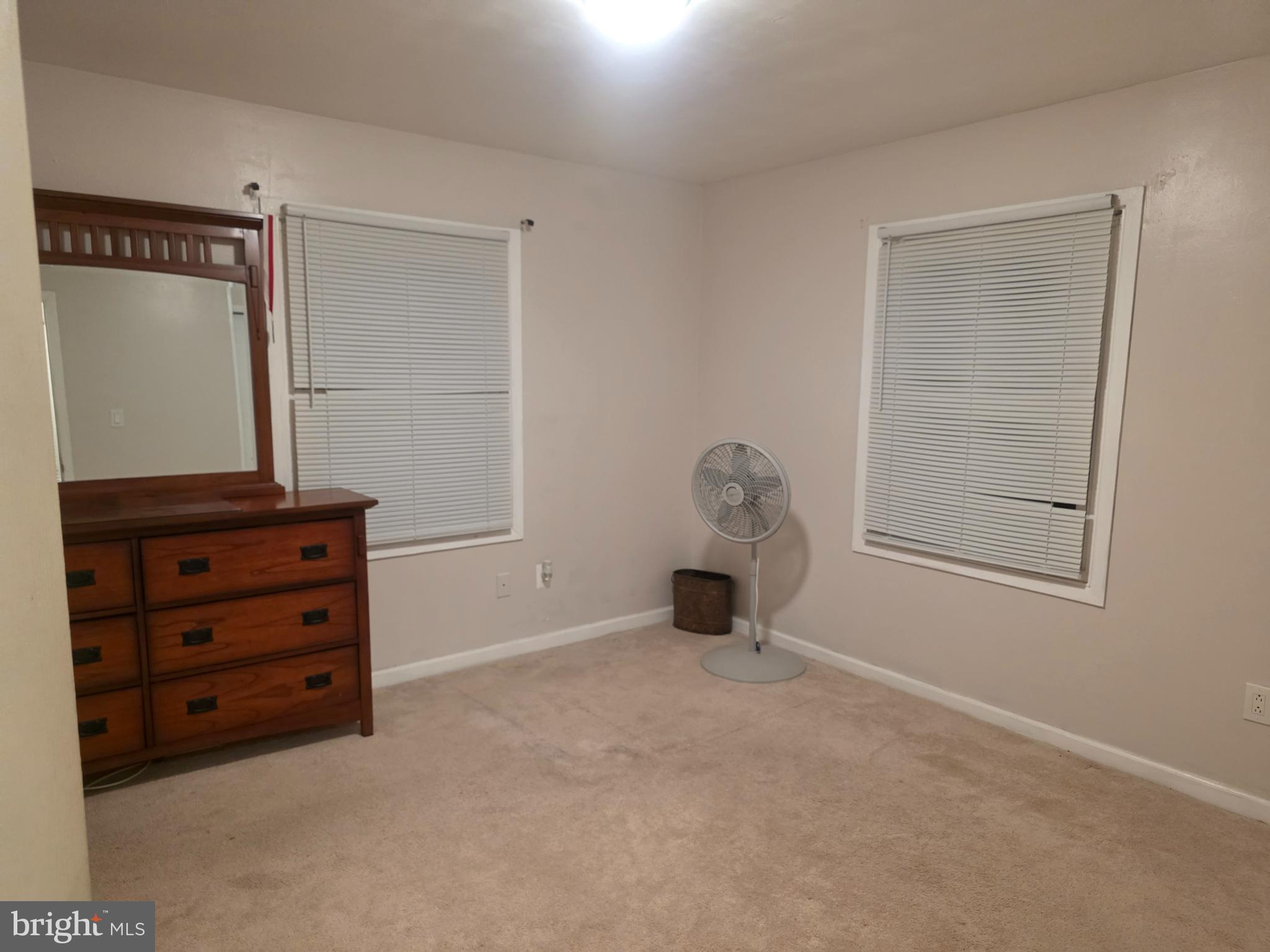 44 Peacock Lane Willingboro, NJ 08046 - Photo 13 of 23 an empty room with a cabinet and mirror