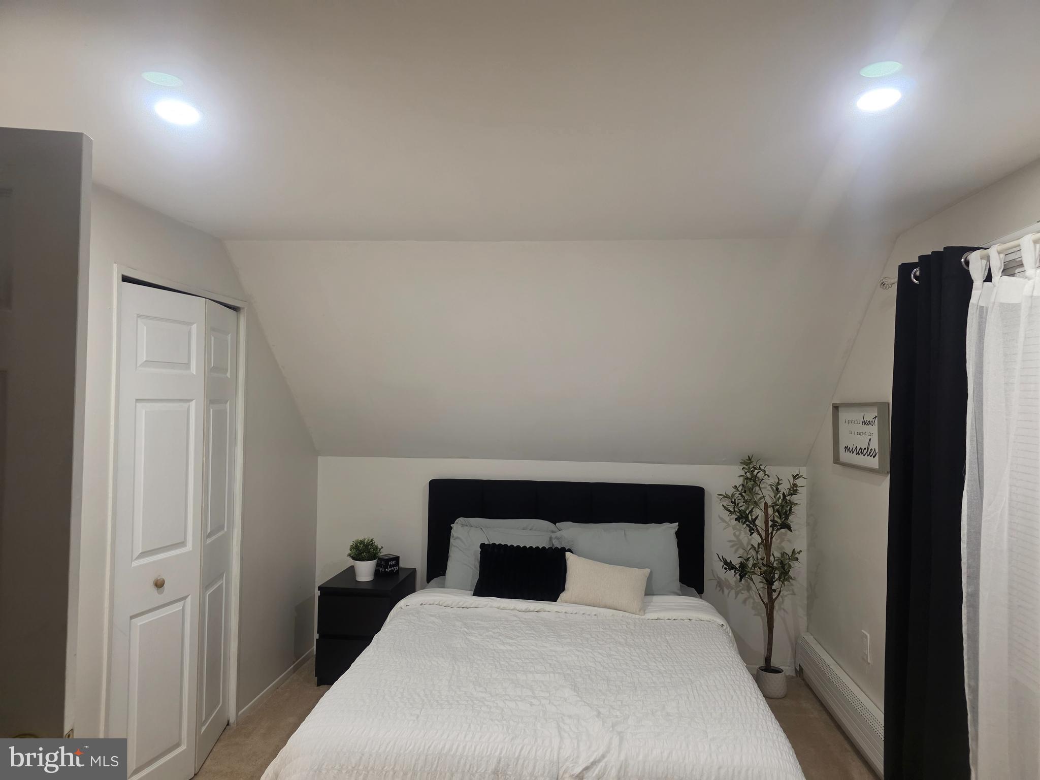 44 Peacock Lane Willingboro, NJ 08046 - Photo 23 of 23 a bedroom with a bed and a refrigerator