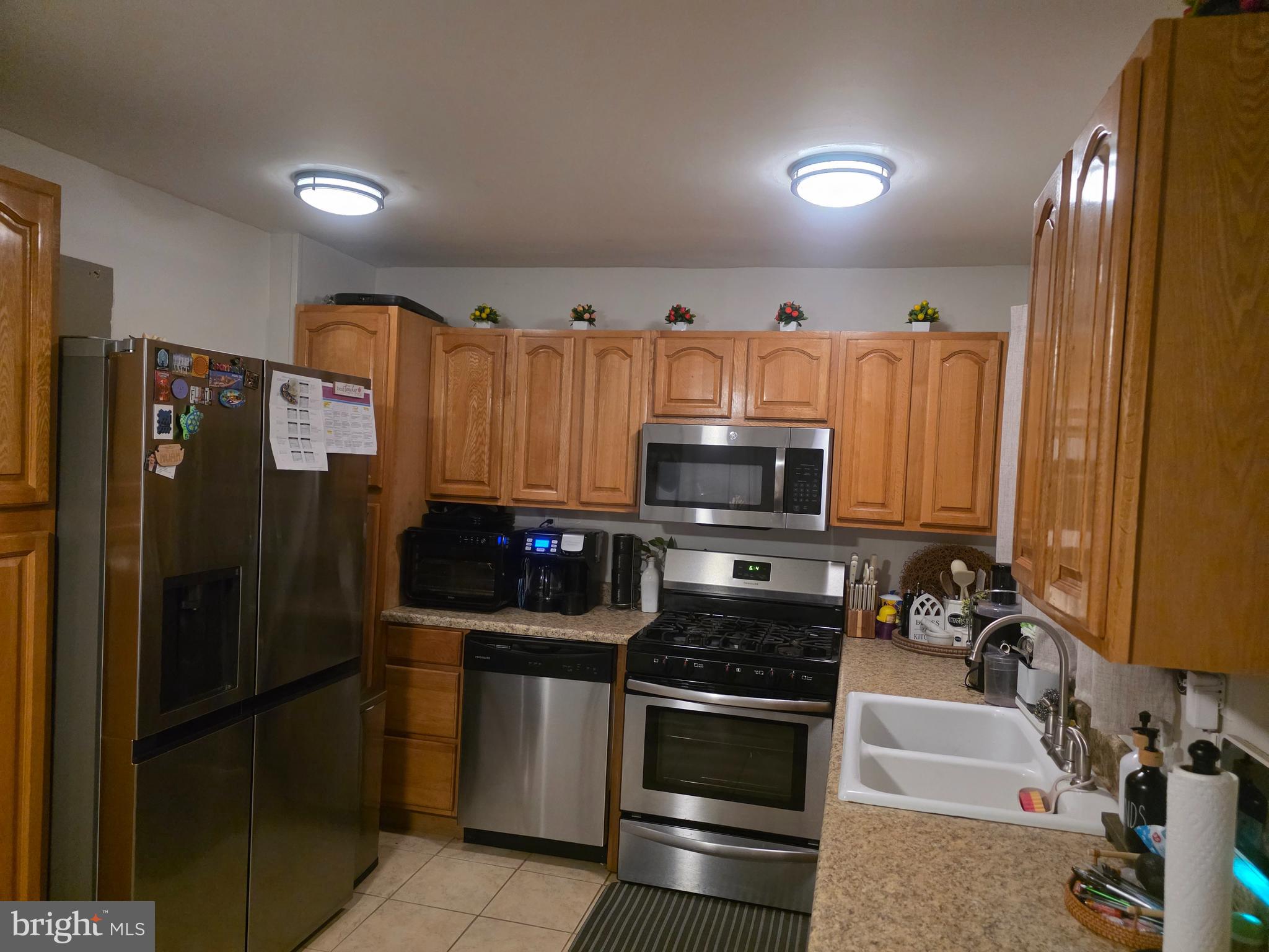 44 Peacock Lane Willingboro, NJ 08046 - Photo 5 of 23 a kitchen with stainless steel appliances a refrigerator stove and microwave