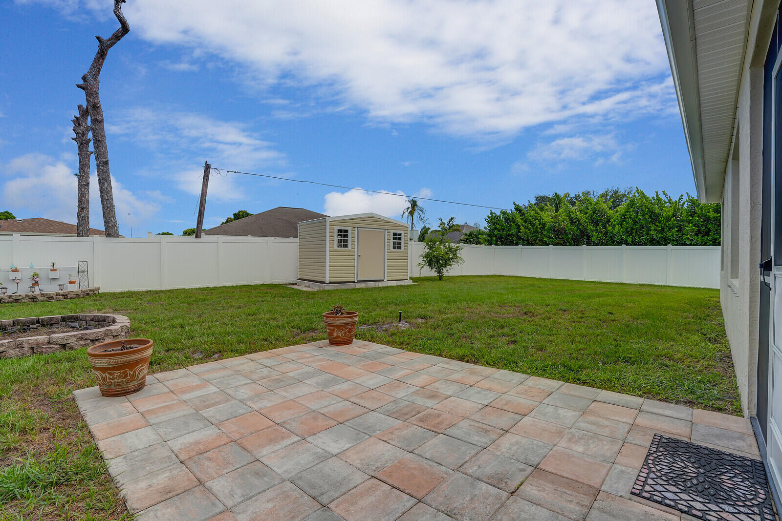 1401 Southeast Portillo Road Port St. Lucie, FL 34952 - Photo 37 of 41 Fully fenced backyard and storage shed