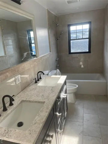a bathroom with a sink and a toilet