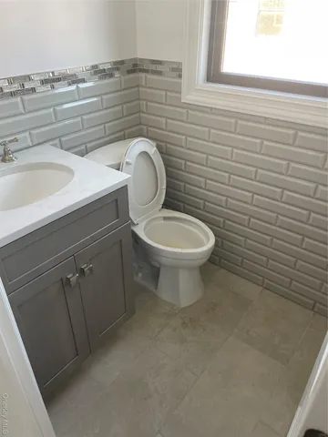 a bathroom with a toilet and a sink