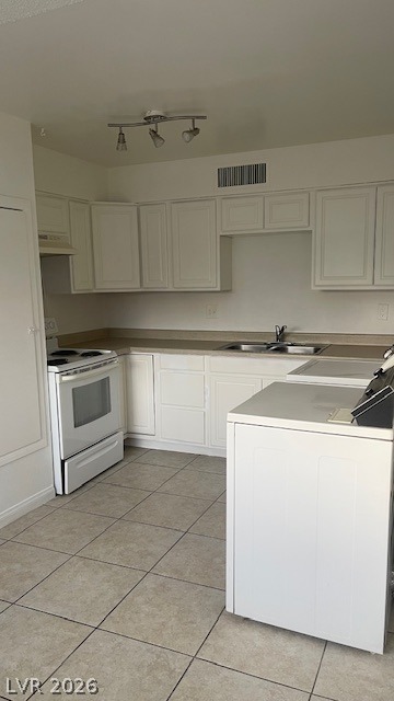 350 East Desert Inn Road, Unit B103 Las Vegas, NV 89109 - Photo 14 of 22 A well-appointed kitchen showcasing efficient appliances and ample cabinetry.
