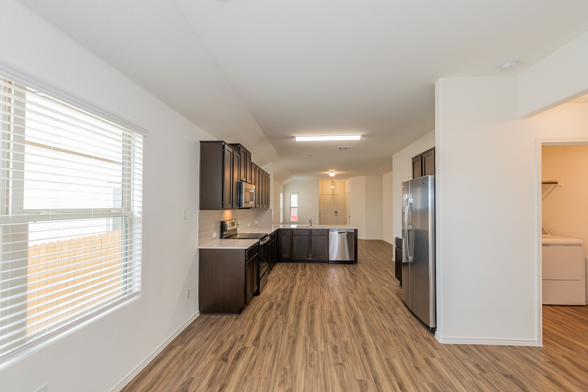 509 Greatest Gift Way Jarrell, TX 76537 - Photo 13 of 28 a view of a kitchen from the hallway