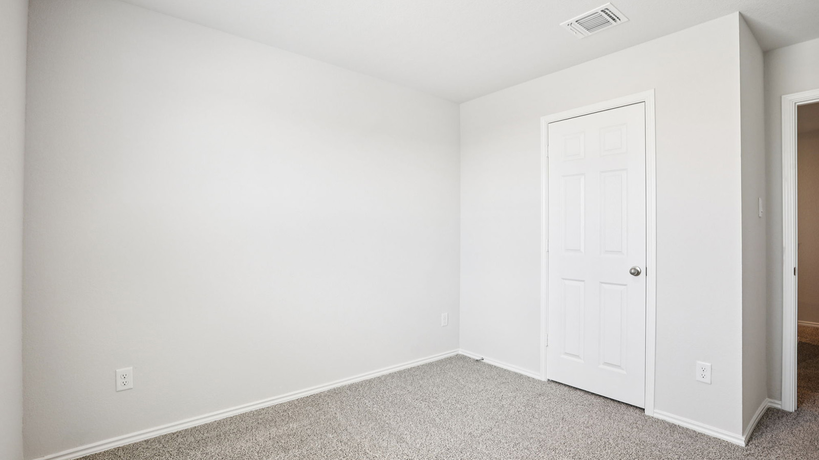 133 Wyatt Way Jarrell, TX 76537 - Photo 21 of 32 Neutral-toned walls and grey carpeting create a versatile interior