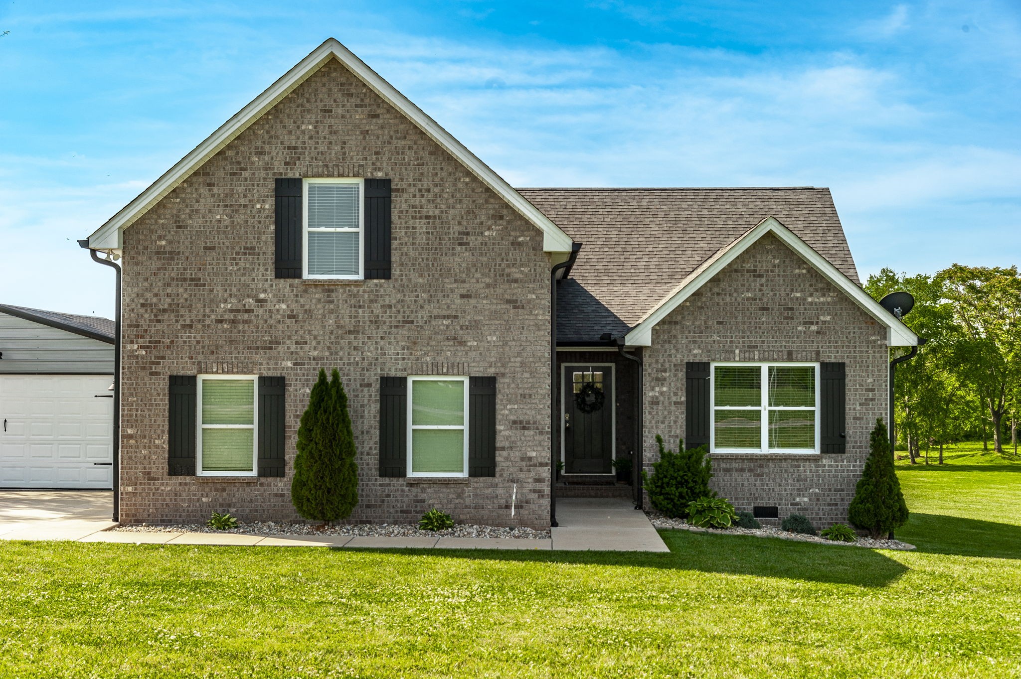 1261 Friendship Road Cross Plains, TN 37049 - Photo 1 of 47 a front view of a house with a yard