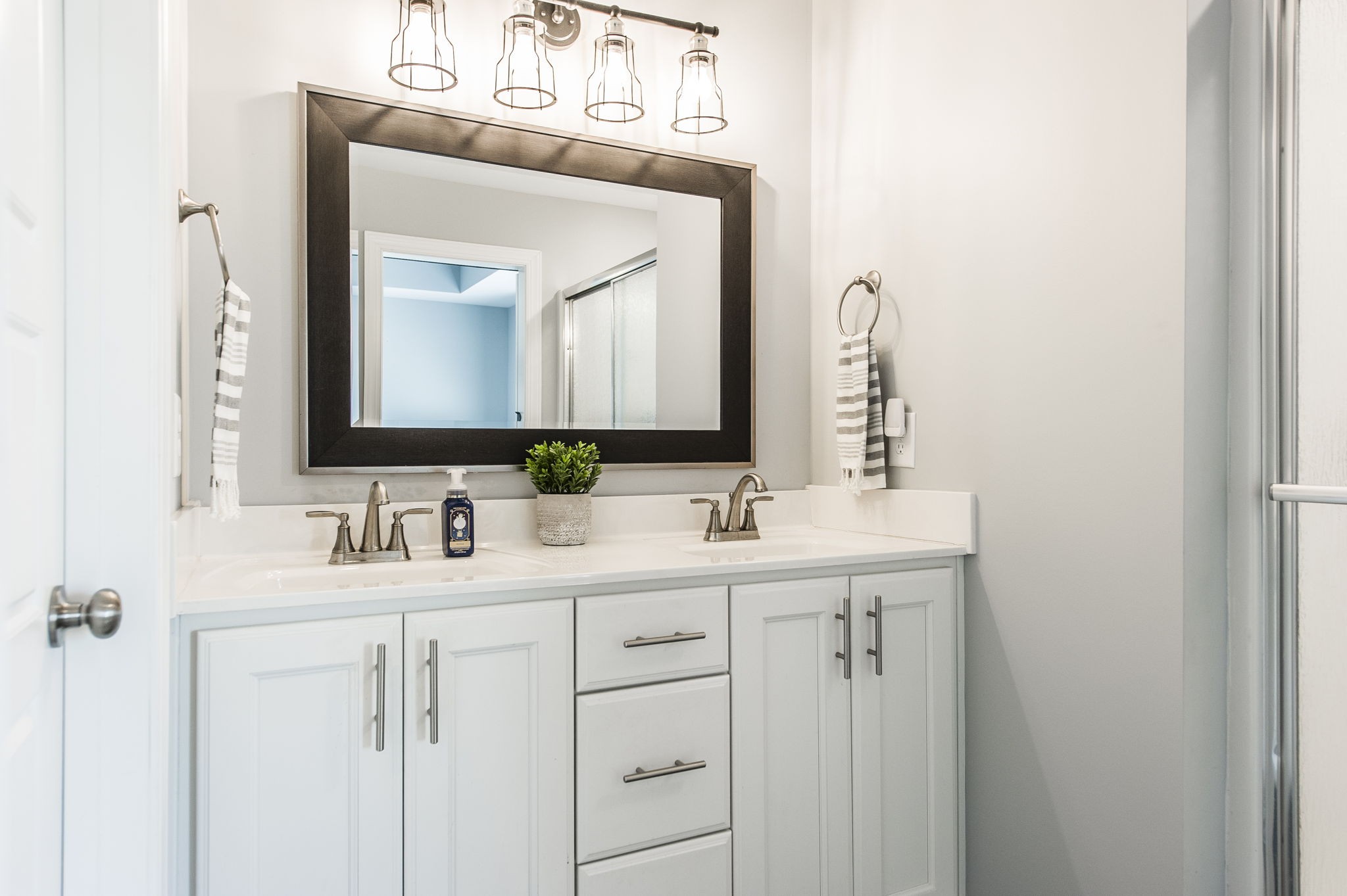 1261 Friendship Road Cross Plains, TN 37049 - Photo 24 of 47 a bathroom with a double vanity sink and a mirror