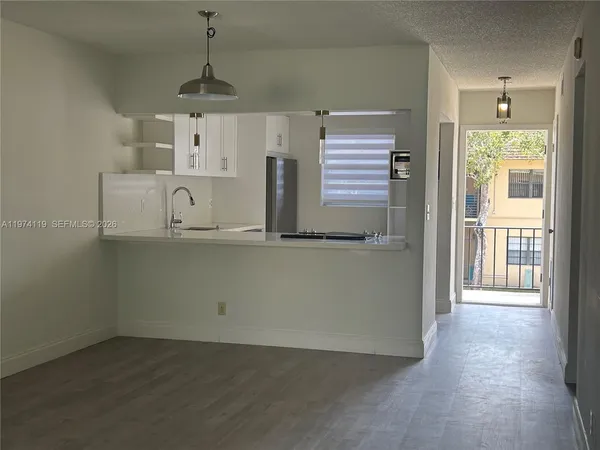 a bathroom with a toilet a sink and shower