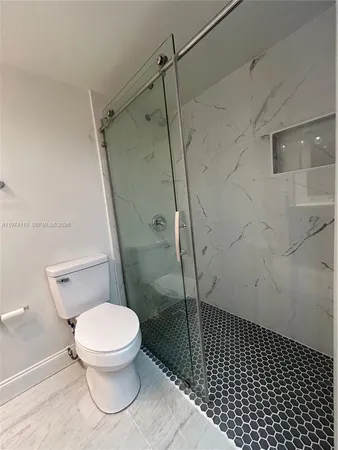 a living room with furniture a table and wooden floor