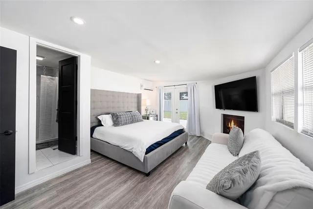 a living room with a couch a flat screen tv and a couch