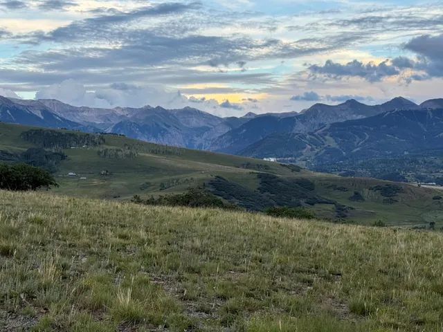 a view of a lake and mountains