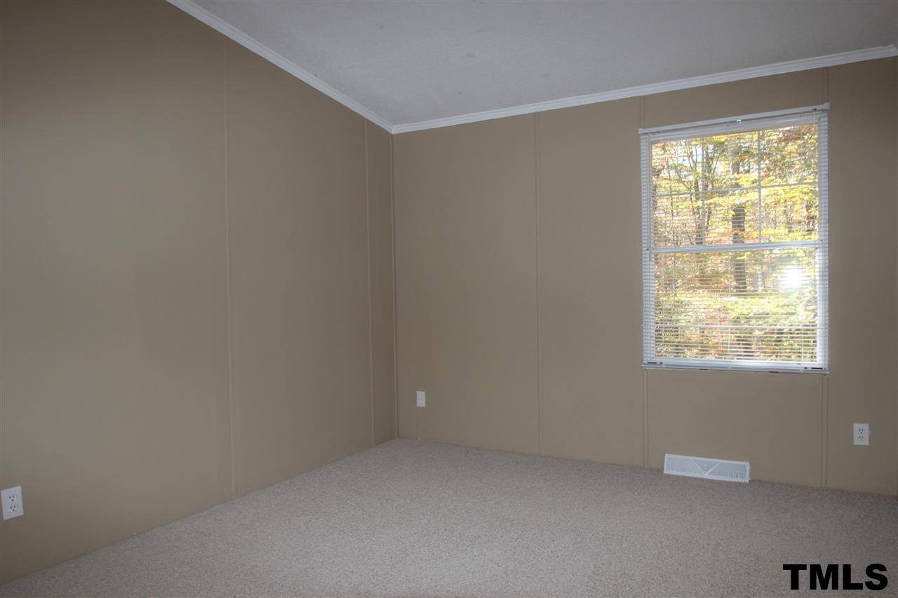 265 Heritage Road Roxboro, NC 27574 - Photo 11 of 13 Bedroom 2 with new carpet and paint