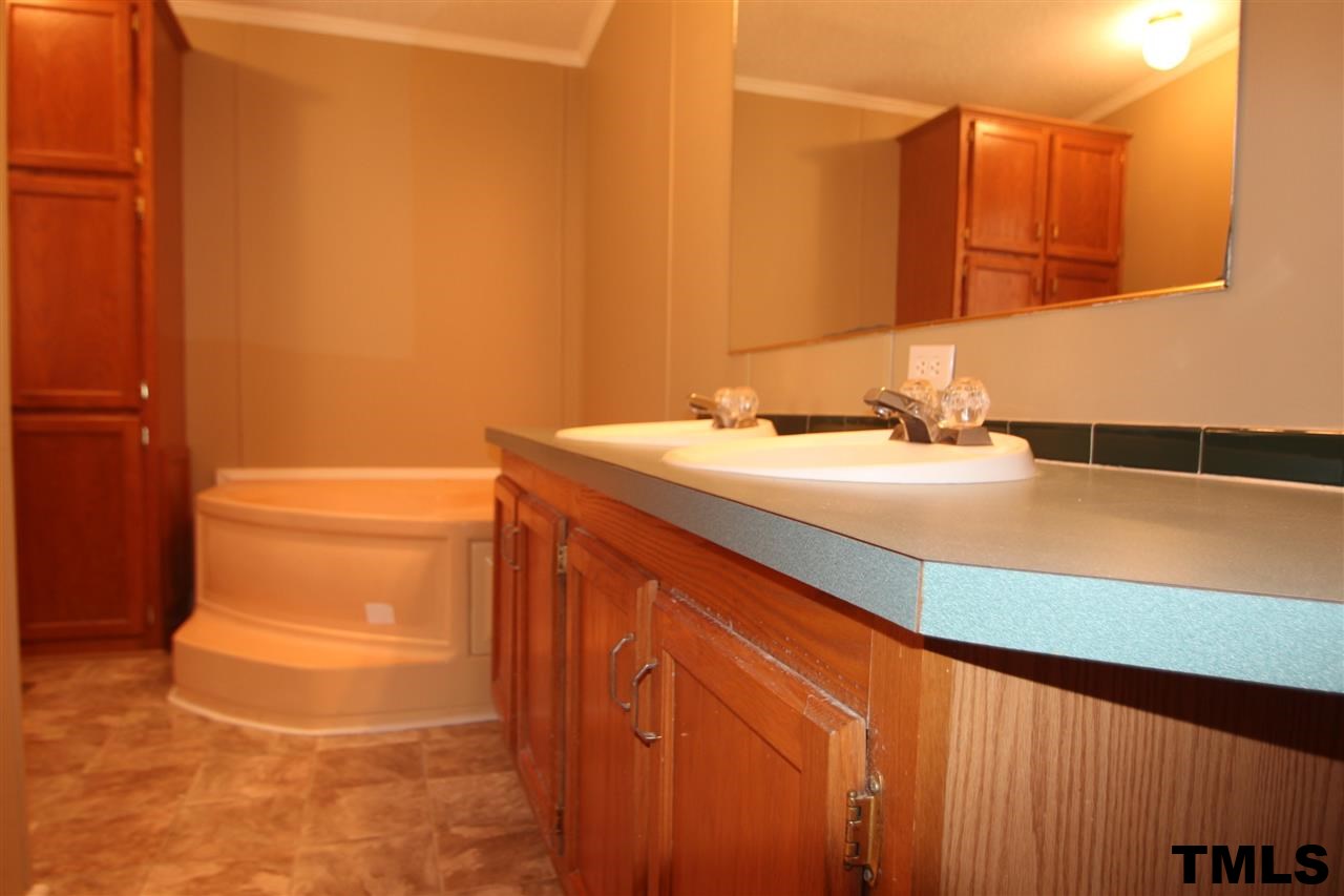 265 Heritage Road Roxboro, NC 27574 - Photo 7 of 13 Master spa with garden tub, separate shower and dual vanity