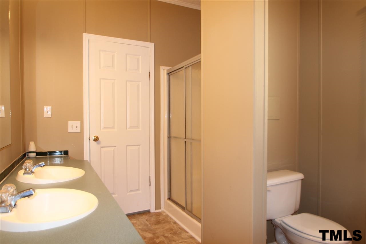 265 Heritage Road Roxboro, NC 27574 - Photo 8 of 13 Master spa with garden tub, separate shower and dual vanity