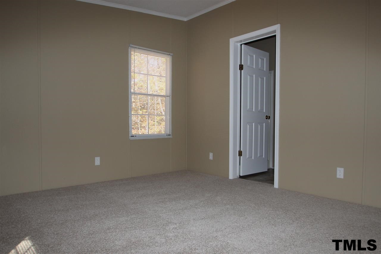 265 Heritage Road Roxboro, NC 27574 - Photo 9 of 13 Master bedroom with new carpet and paint