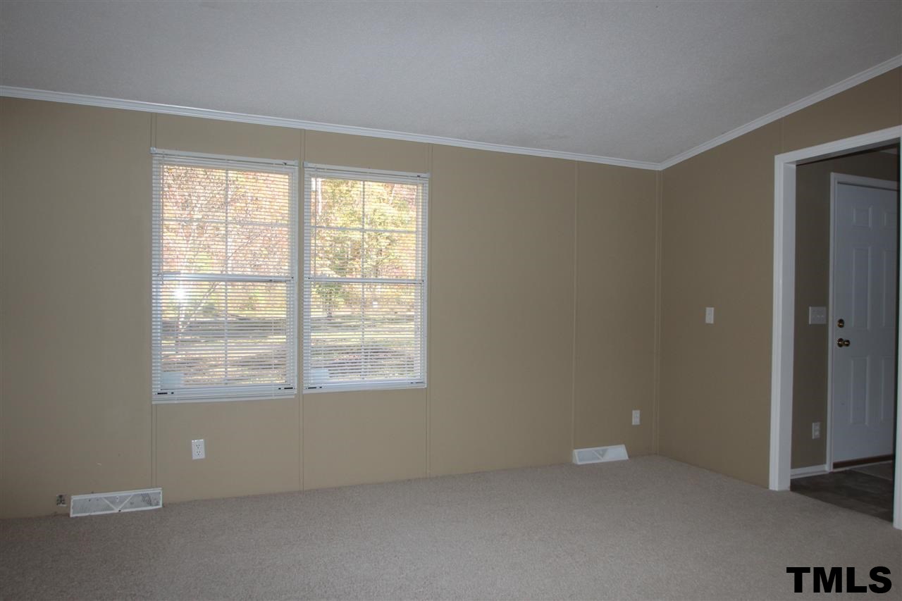 265 Heritage Road Roxboro, NC 27574 - Photo 10 of 13 Living room with new carpet and paint