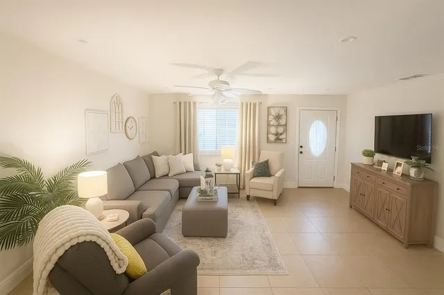 a living room with furniture and a flat screen tv