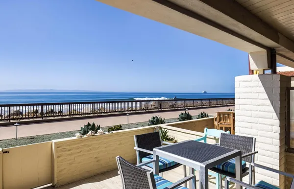 a view of a chairs and table on the terrace