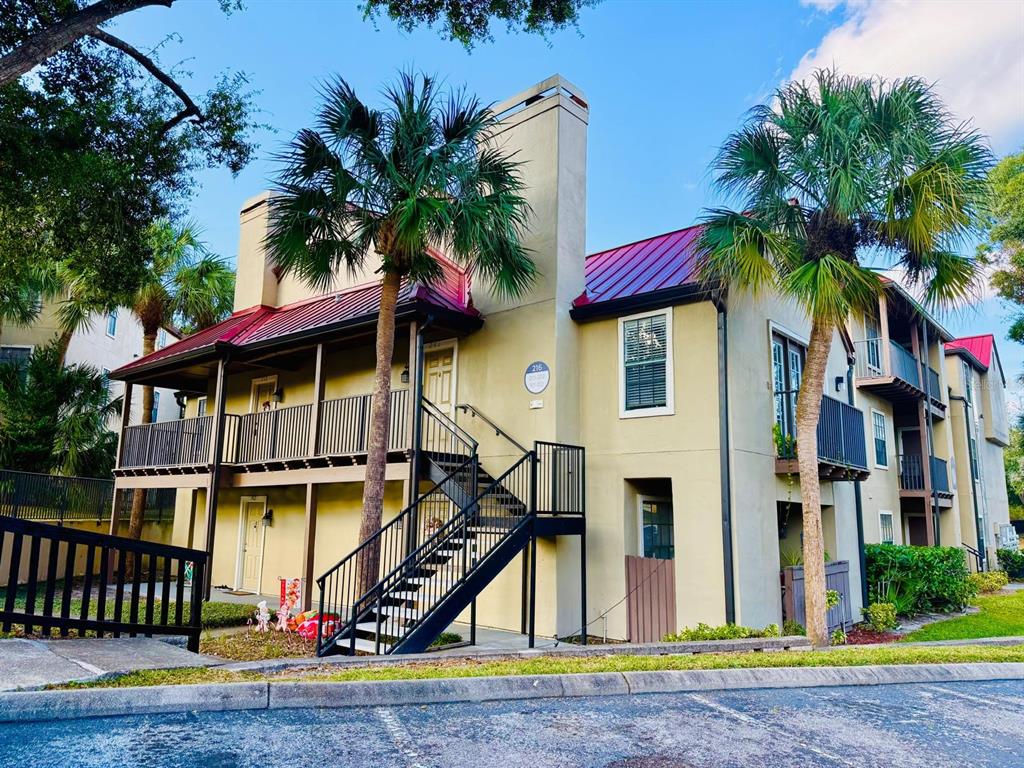 a view of a house with swimming pool and sitting area