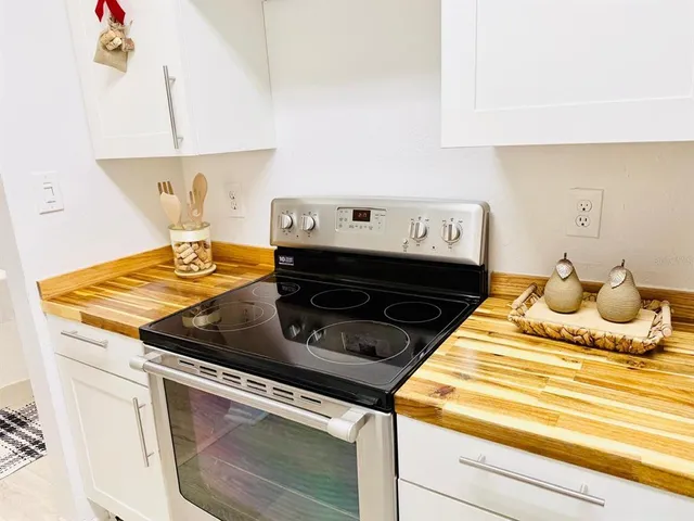 a kitchen with a stove and a refrigerator