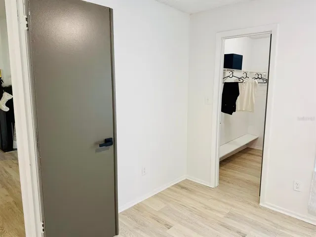 a bathroom with a sink toilet vanity and tub
