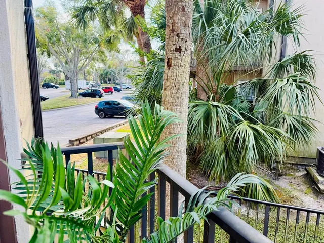 a living room with furniture and a clock