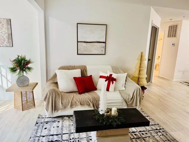 a living room with furniture and a table