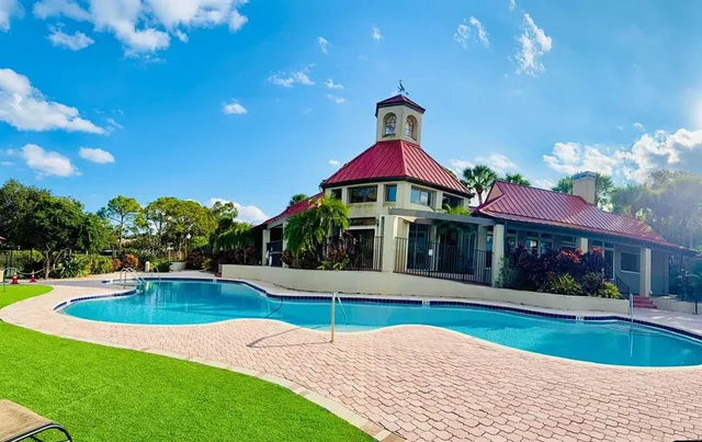 a view of a lake with houses in the background
