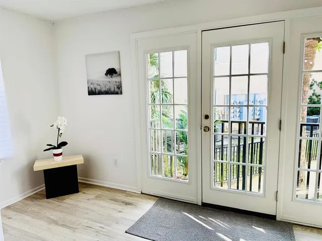 a living room with a couch dining table and a fireplace