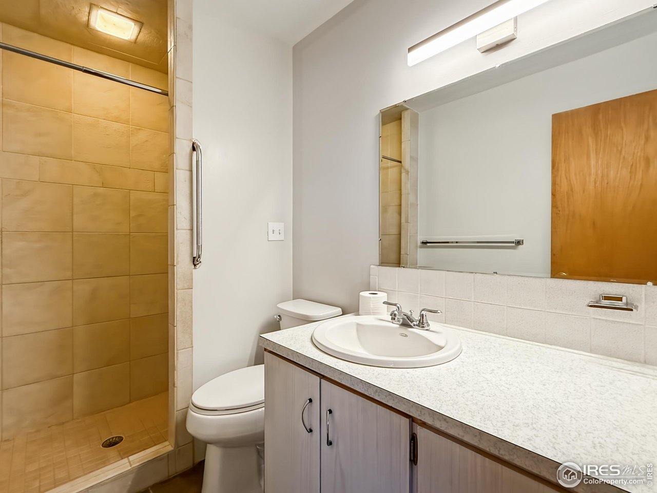 1695 6th Street Limon, CO 80828 - Photo 11 of 32 a bathroom with a sink a toilet and shower