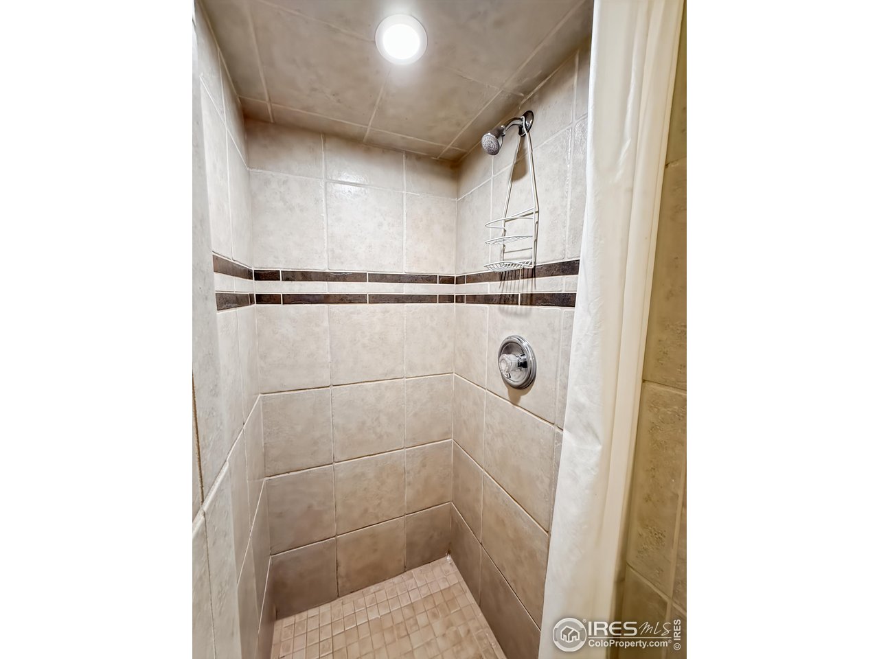1695 6th Street Limon, CO 80828 - Photo 17 of 32 a bathroom with a shower
