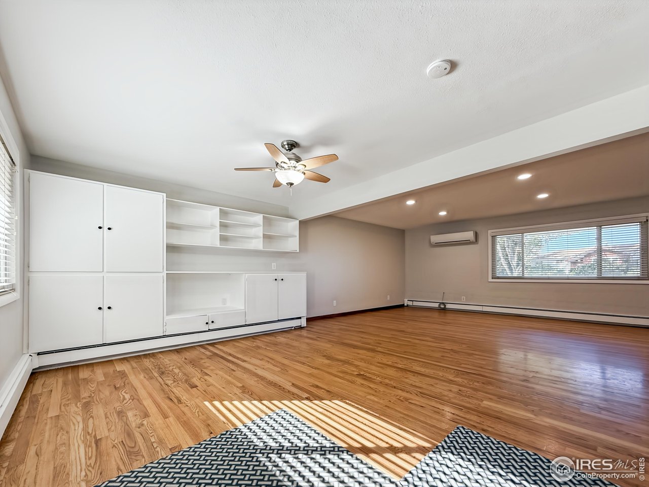 1695 6th Street Limon, CO 80828 - Photo 4 of 32 a view of an empty room with window and wooden floor