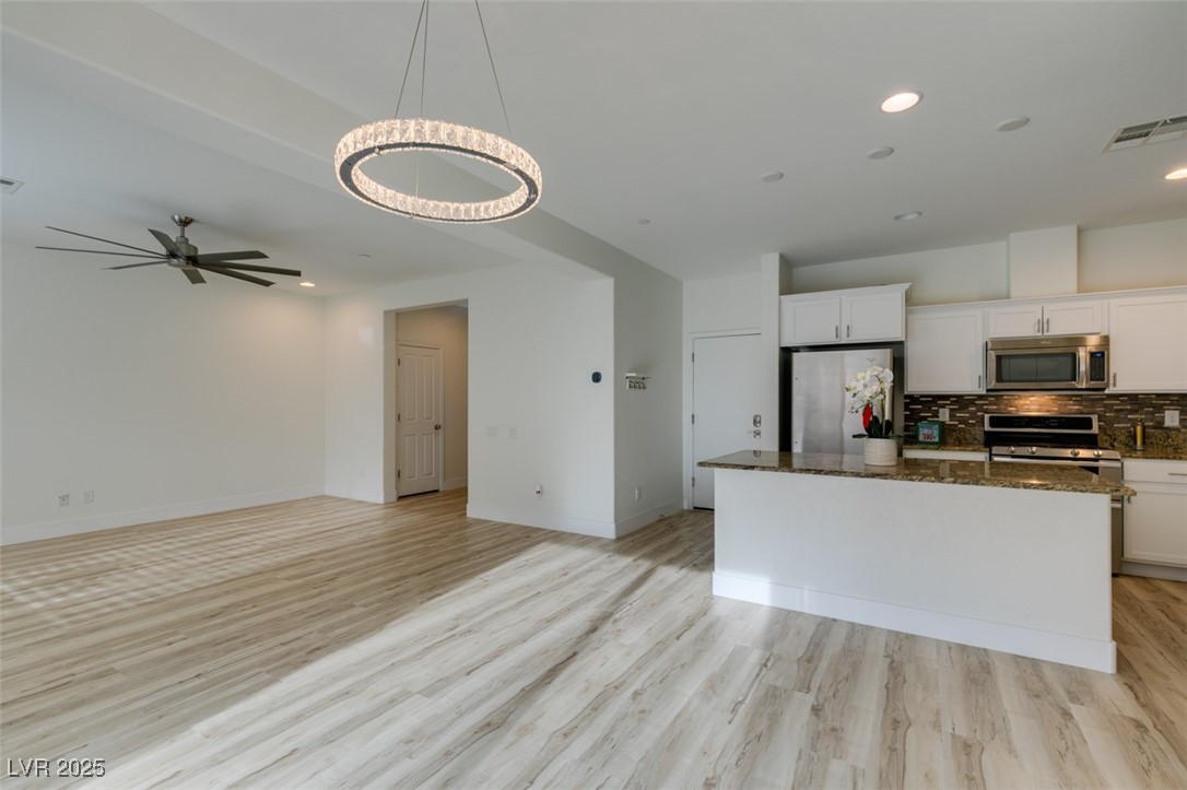 2617 Courgette Way Henderson, NV 89044 - Photo 24 of 52 Dining area with lovely modern contemporary chandelier