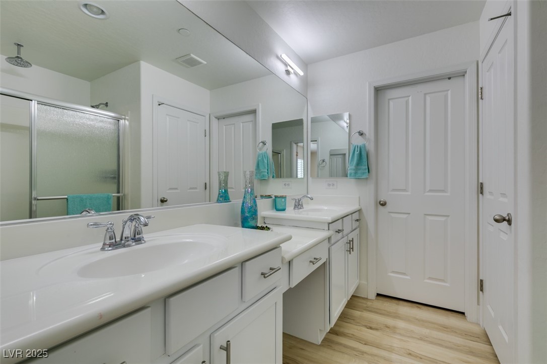 2617 Courgette Way Henderson, NV 89044 - Photo 44 of 52 Remodeled master bathroom with new flooring, freshly painted cabinets, new light fixtures