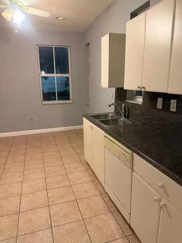 a view of a bathroom with a tub and a window