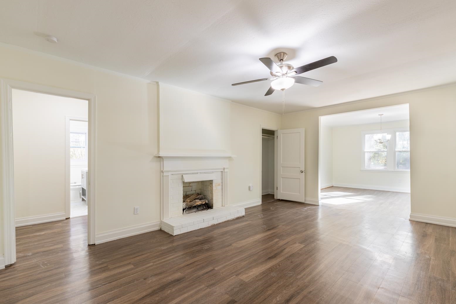 10338 Long Road Arlington, TN 38002 - Photo 8 of 22 a view of empty room with wooden floor and a ceiling fan