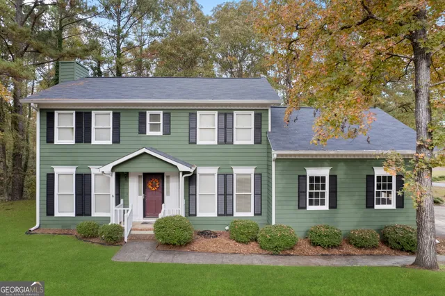 front view of a house with a yard