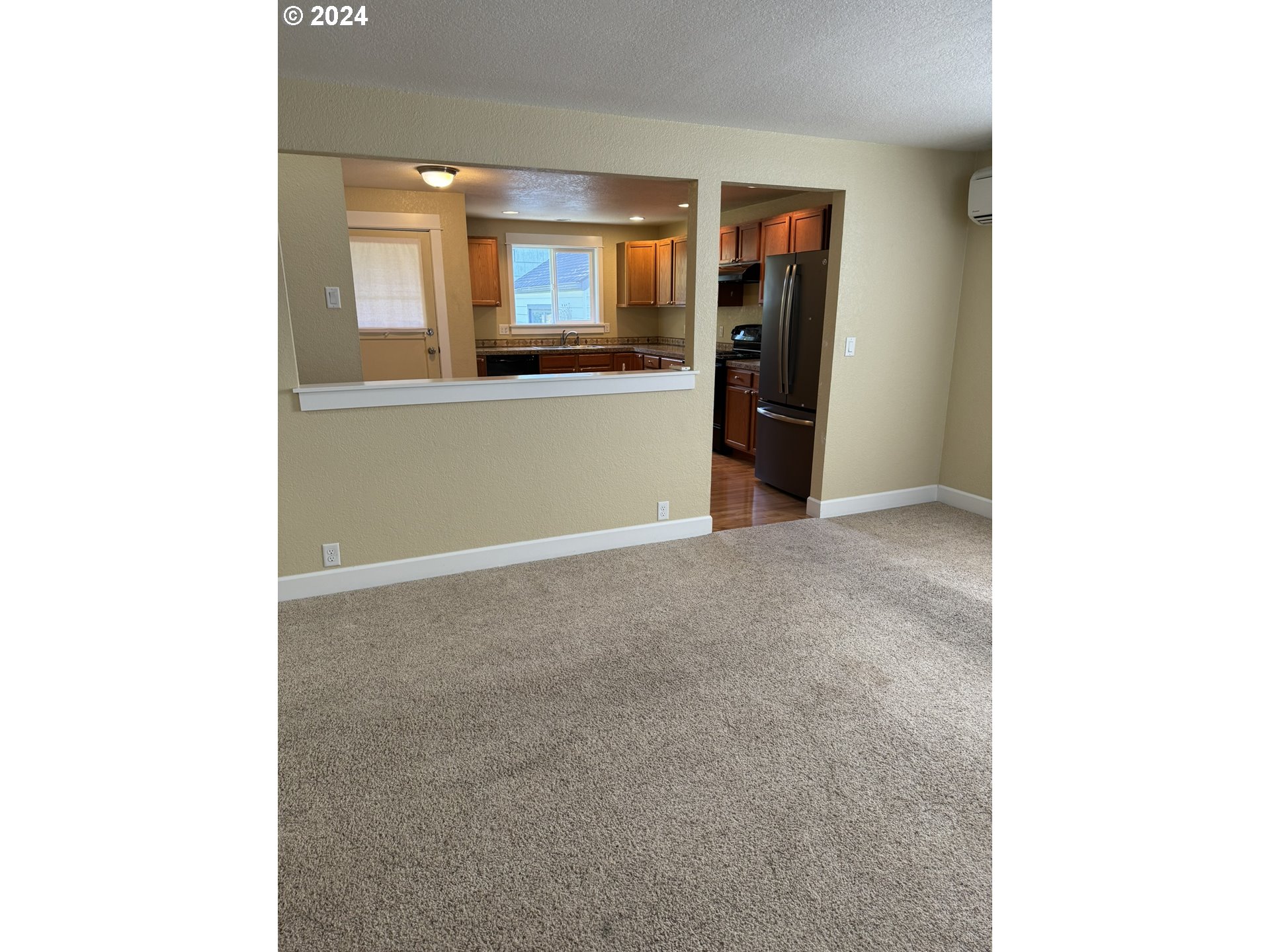395 Irving Road Eugene, OR 97404 - Photo 11 of 37 a view of an empty room with window
