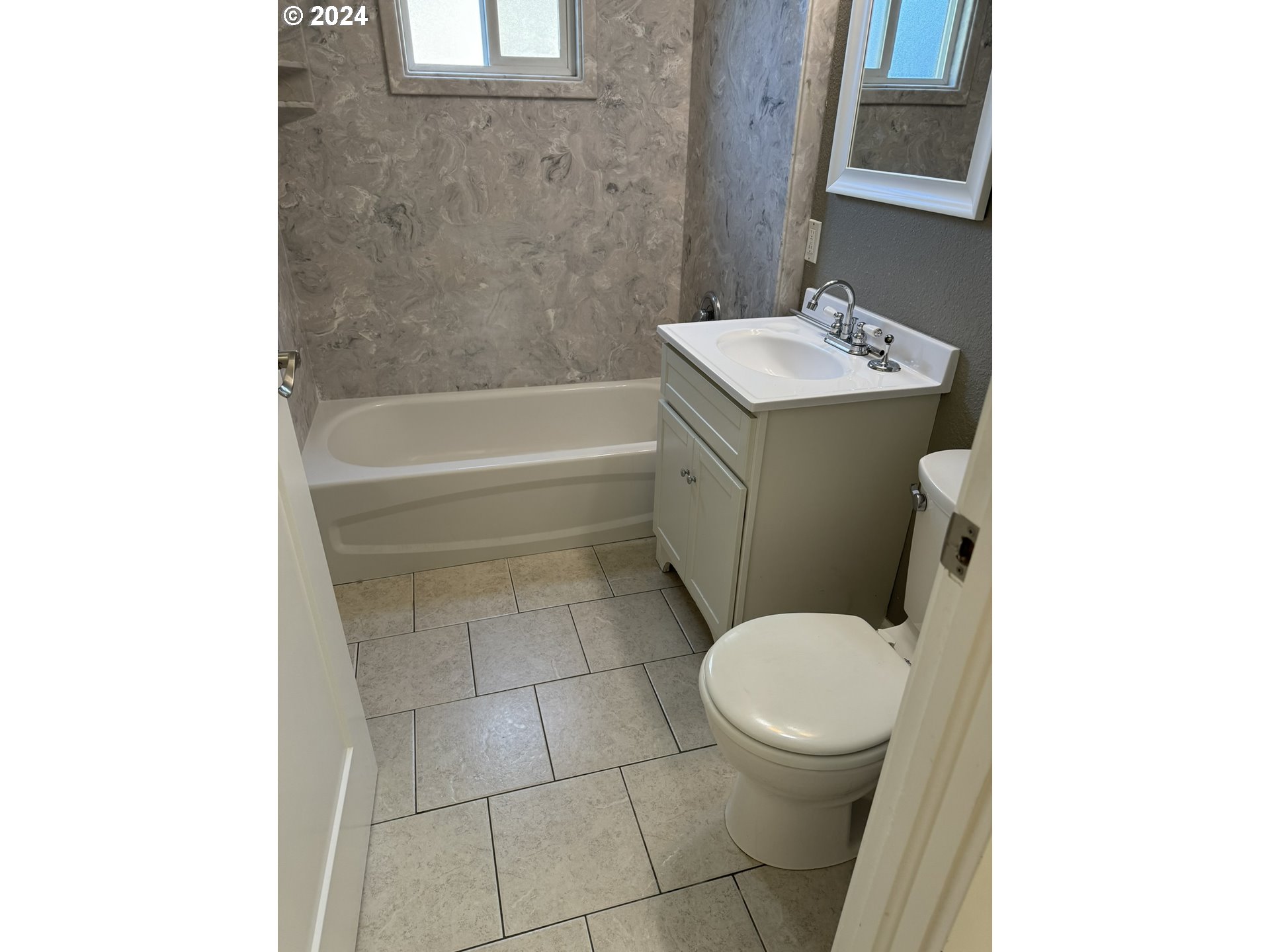 395 Irving Road Eugene, OR 97404 - Photo 18 of 37 a bathroom with a sink a toilet and a bathtub