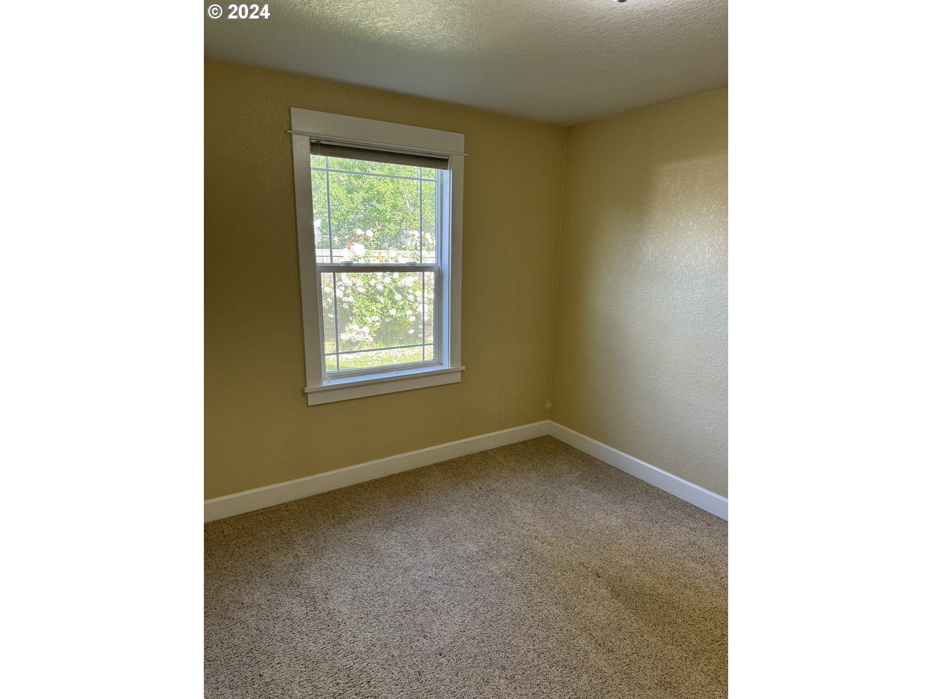 395 Irving Road Eugene, OR 97404 - Photo 23 of 37 a view of an empty room with a window