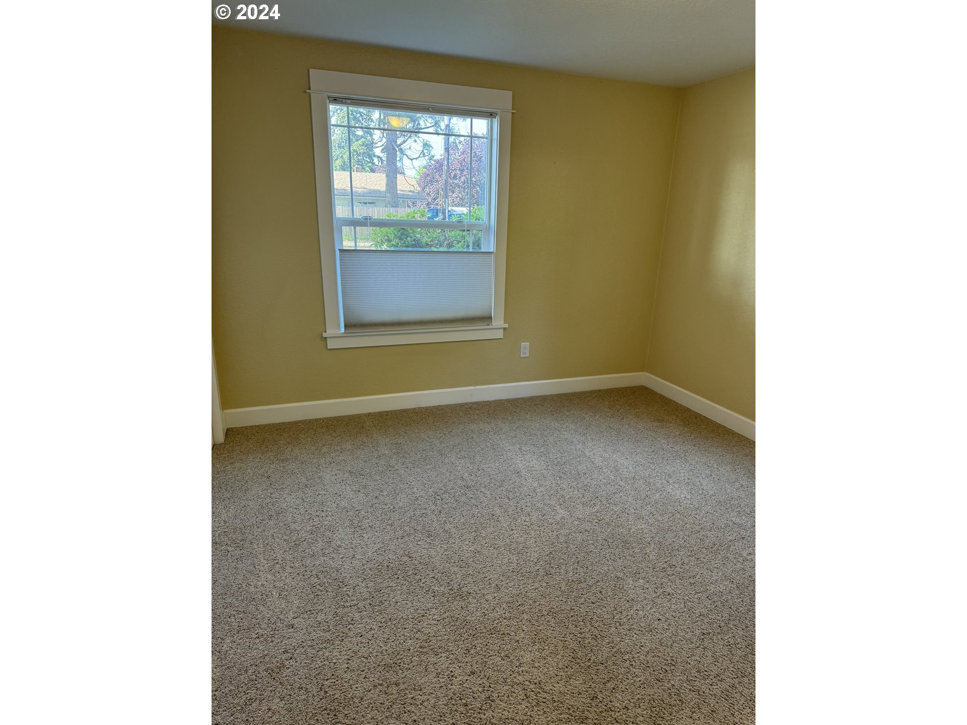 395 Irving Road Eugene, OR 97404 - Photo 24 of 37 a view of an empty room with a window