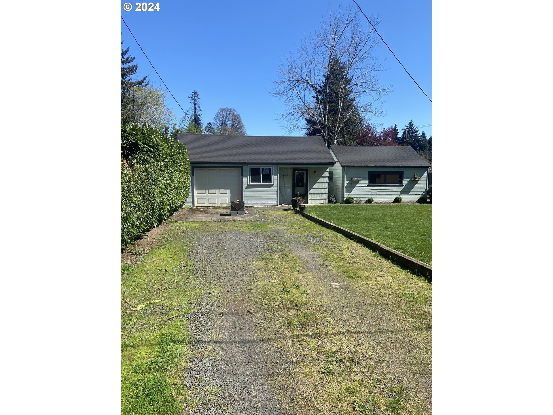 395 Irving Road Eugene, OR 97404 - Photo 27 of 37 a front view of a house with a yard