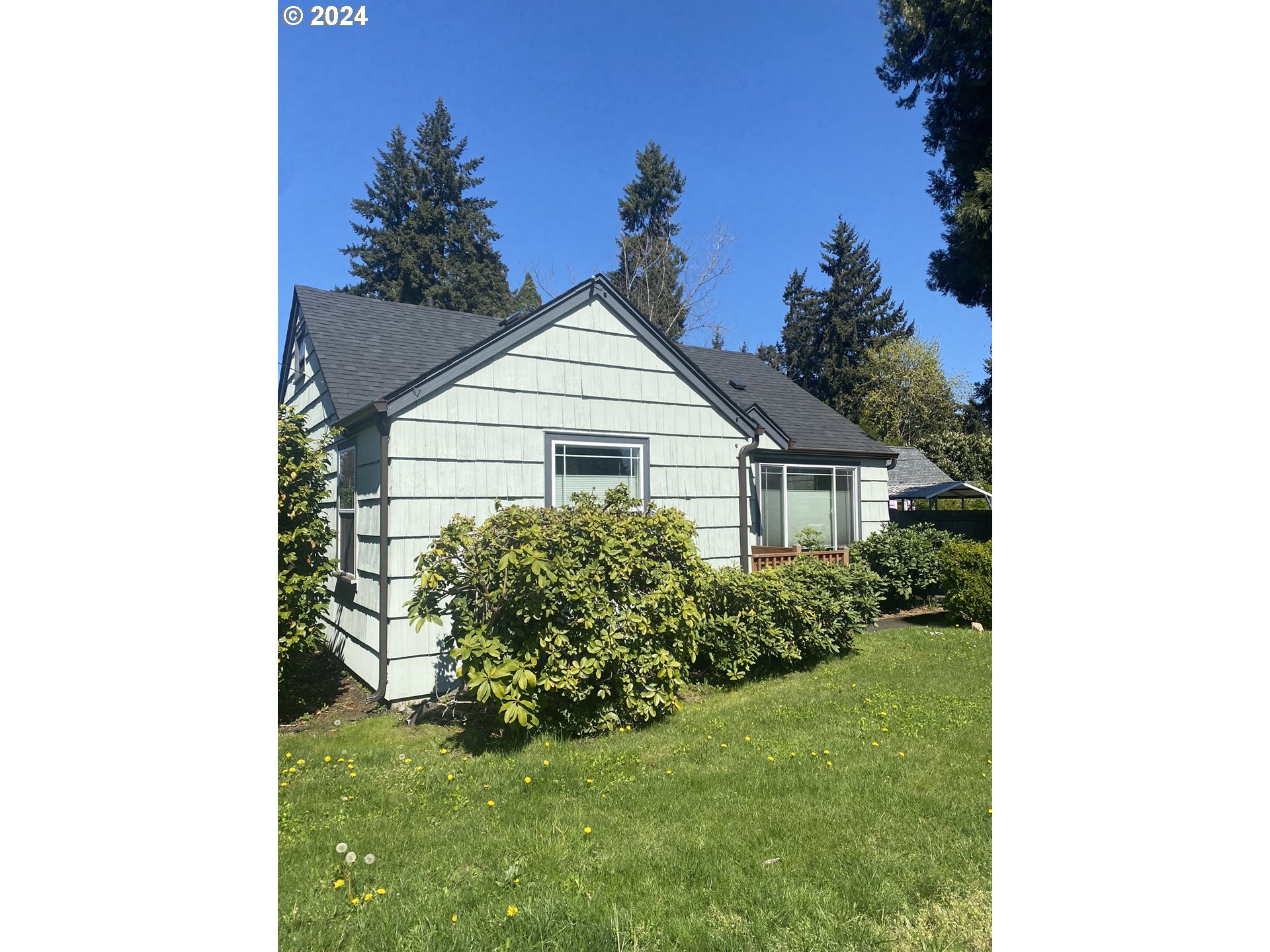 395 Irving Road Eugene, OR 97404 - Photo 30 of 37 a house view with a garden space